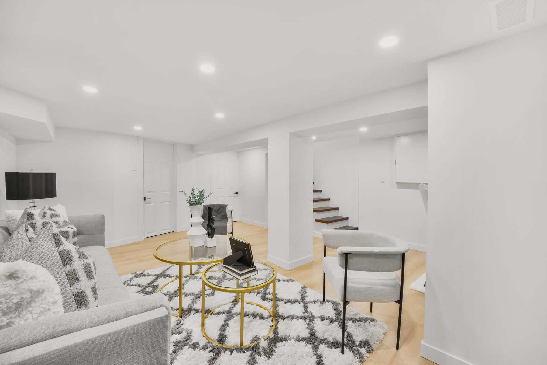 Bright finished basement with dining and lounge areas