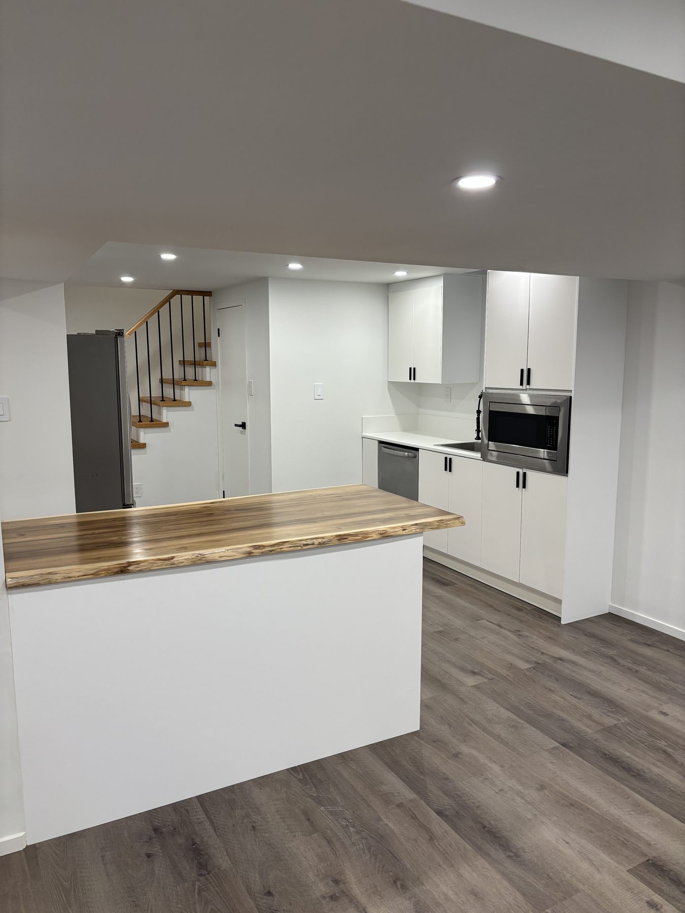 Lower-level kitchenette and stair landing