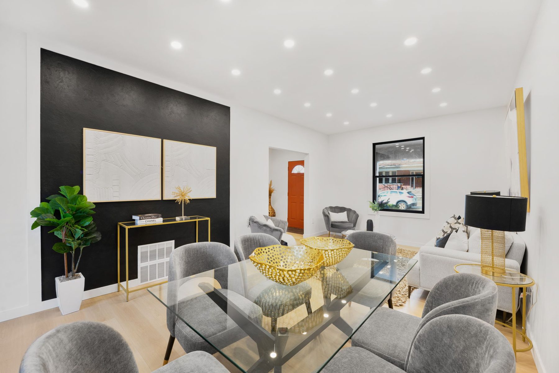 Open dining and living area with black-framed windows