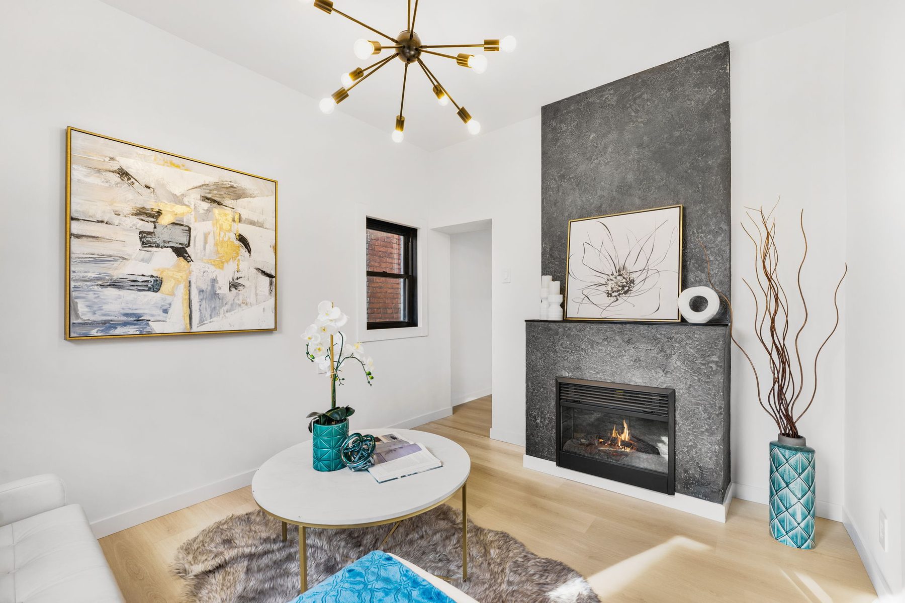 Modern living room centred on a dark stone fireplace