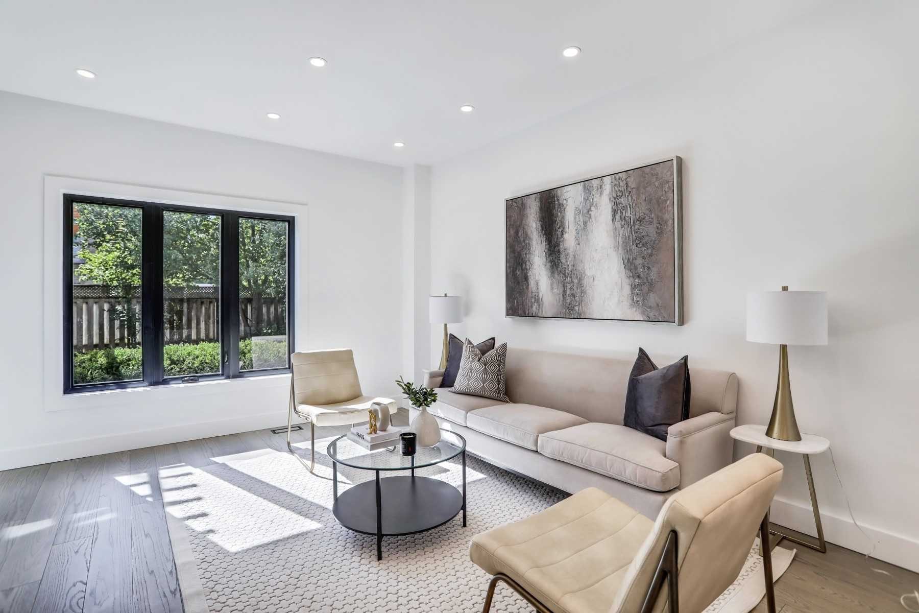 Bright open-plan living room with large windows