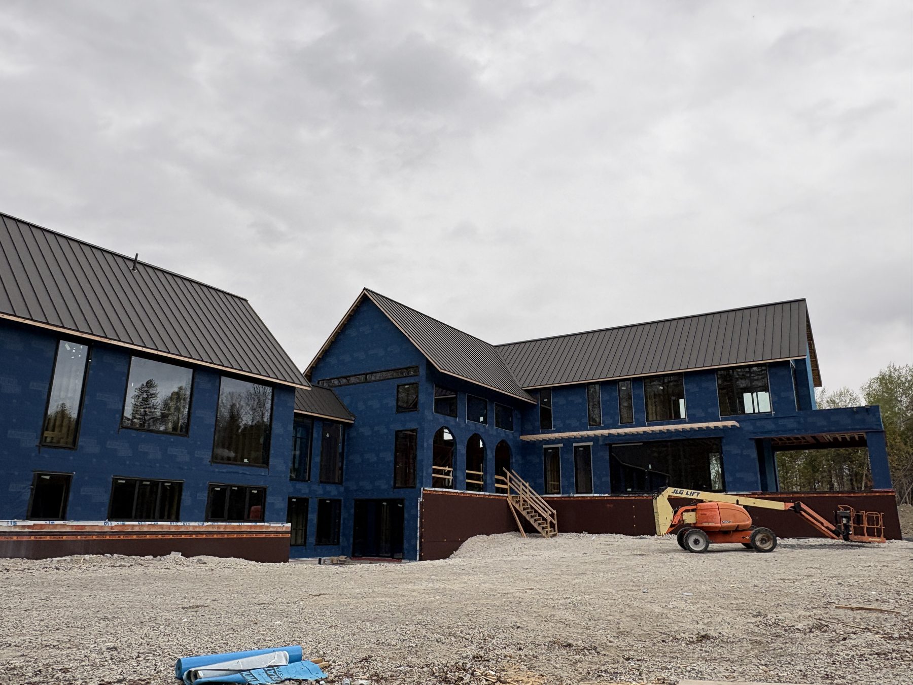 Wide view of a custom-home window package during construction