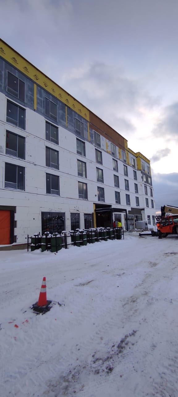 Completed multi-storey façade with residential windows