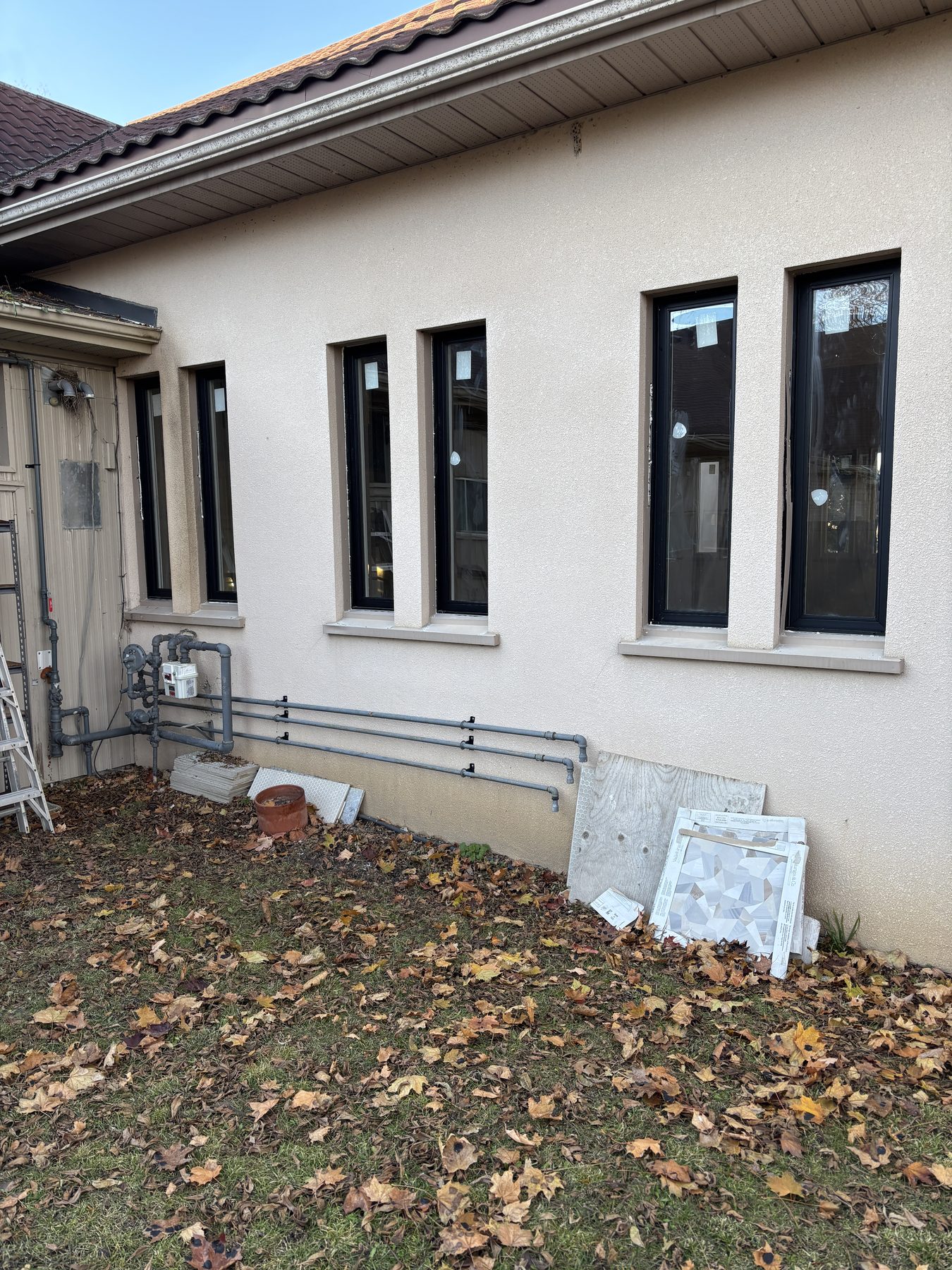 Black-framed windows installed on a residential exterior
