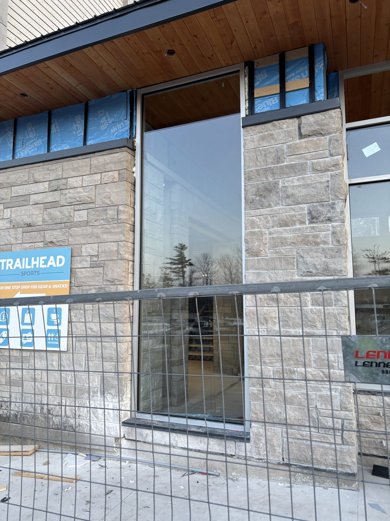 Large window openings set into a masonry façade