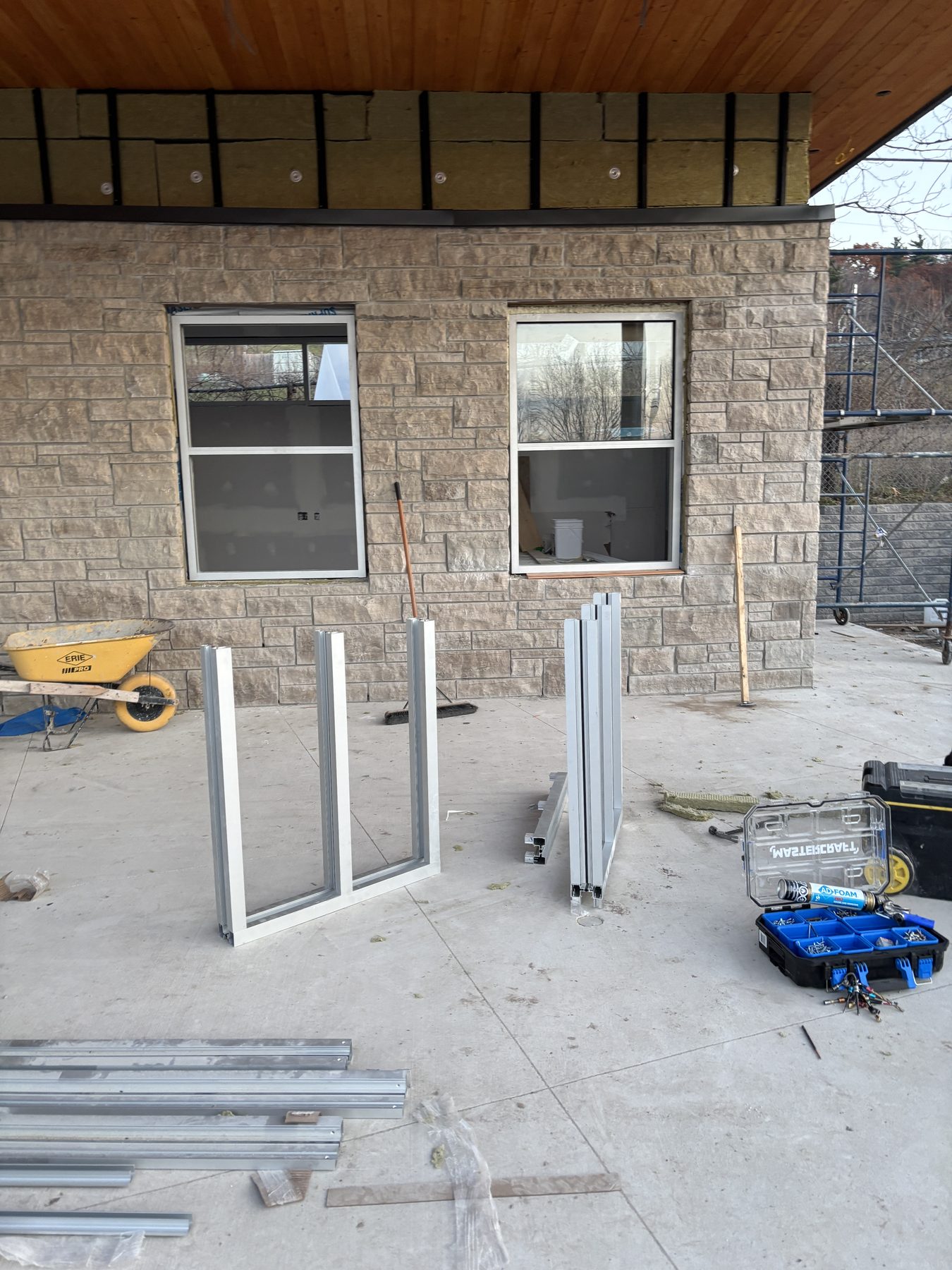 Windows and prepared frames on an active construction site
