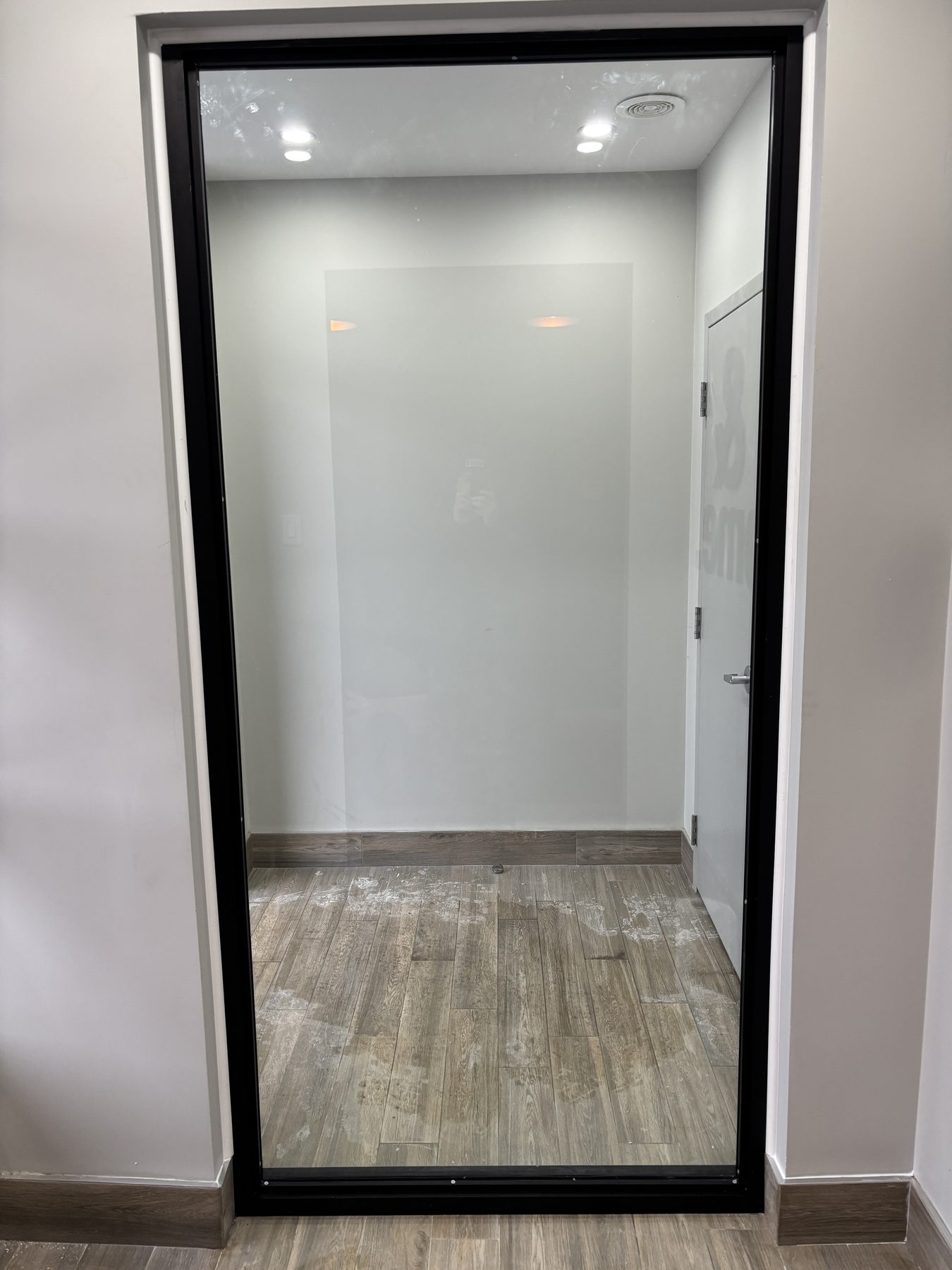 Oversized black-framed interior window opening