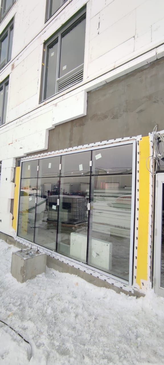 Completed storefront glazing across a wide commercial opening